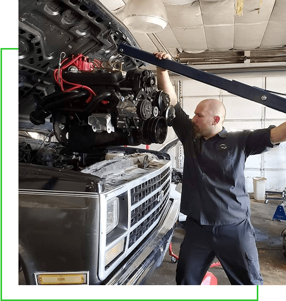 Mechanic Fixing Vehicle Engine